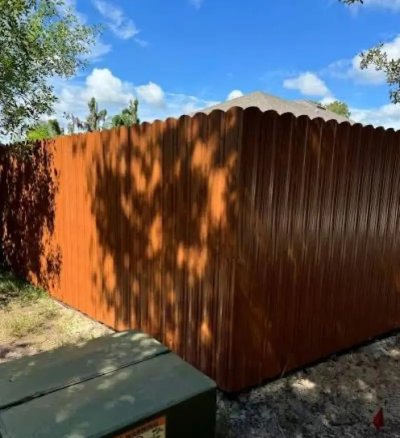 Brown aluminum privacy fence with vertical pickets