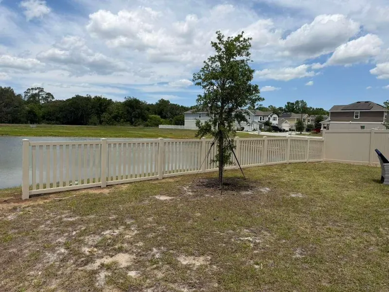 White vinyl privacy fence project completion