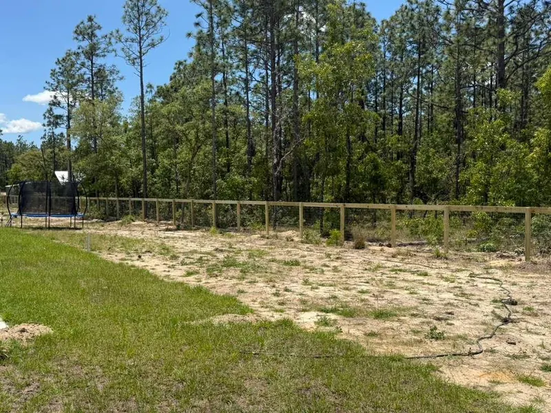 Tall wood privacy fence around a residential lot