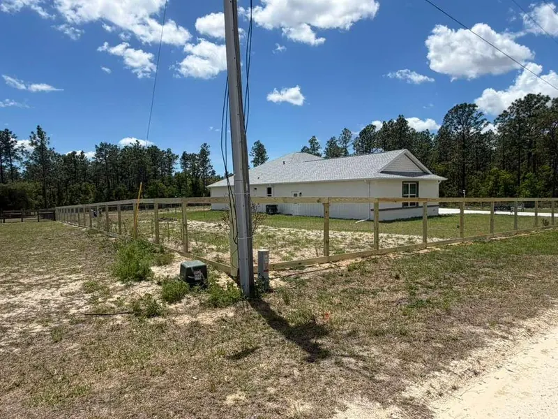 Wood fence corner installation with fresh posts
